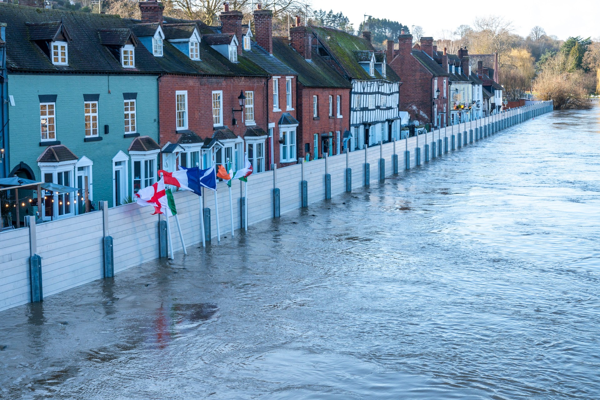 Bewdley , national flags and flood barriers erected to protect local population,Bewdley Bridge,Worcestershire,England,UK
